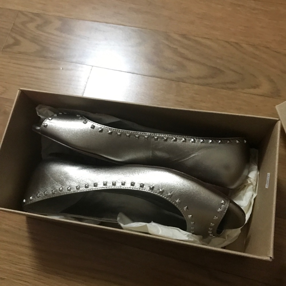 Used once , Cole Haan silver/ grey flats